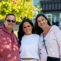 Family standing in front of Kirkhof Center.